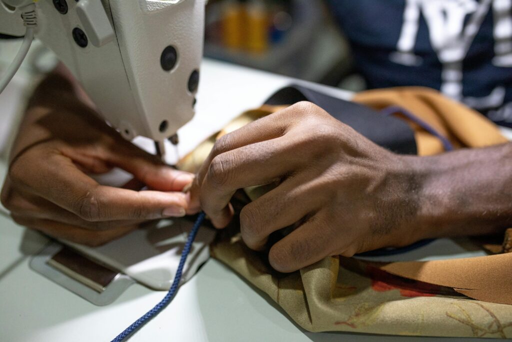 hands working at sewing machine