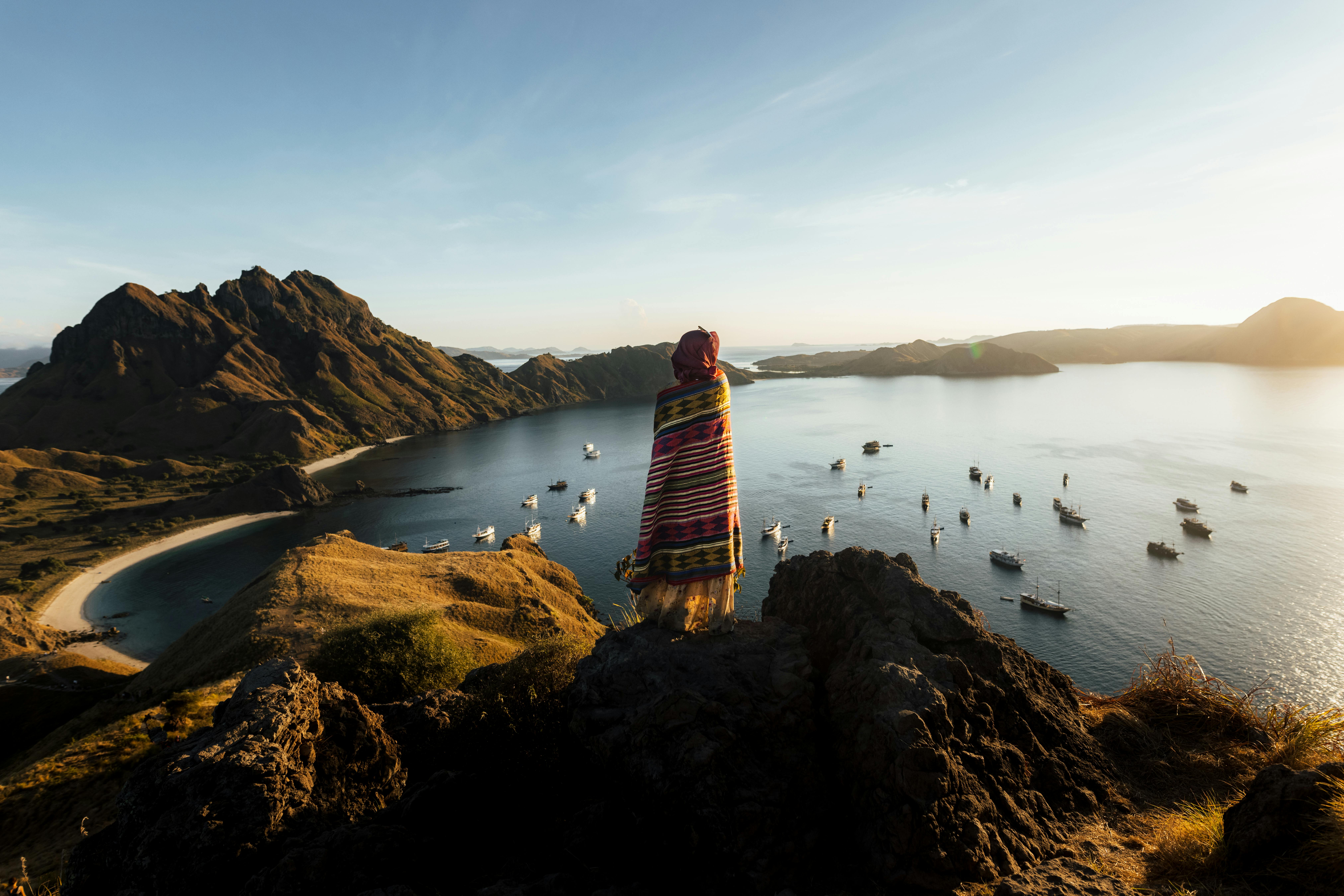 image of woman standing on mountain