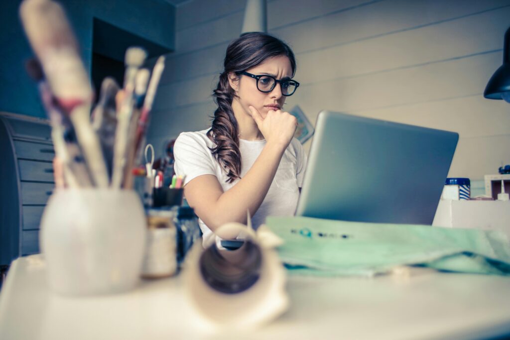 woman sitting at desk with laptop