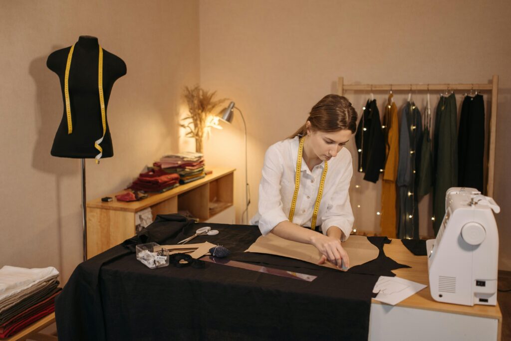 young woman cutting a pattern
