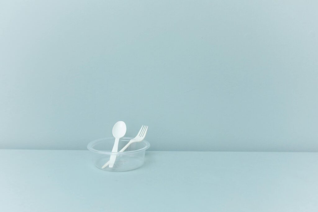 plastic cutlery in plastic bowl