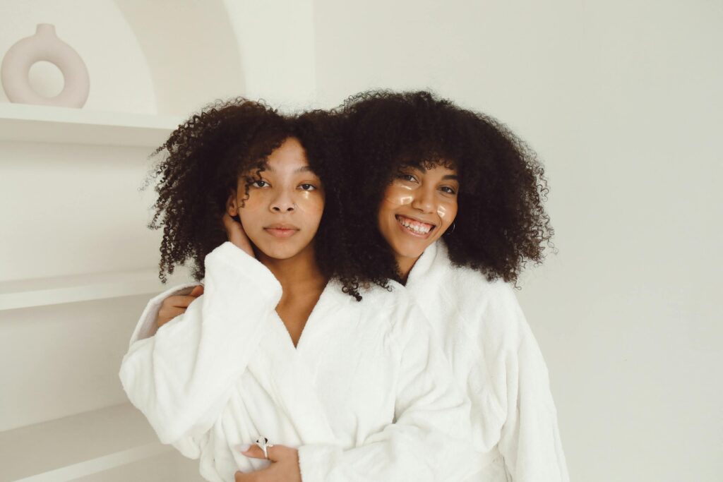 two sisters with curly hair