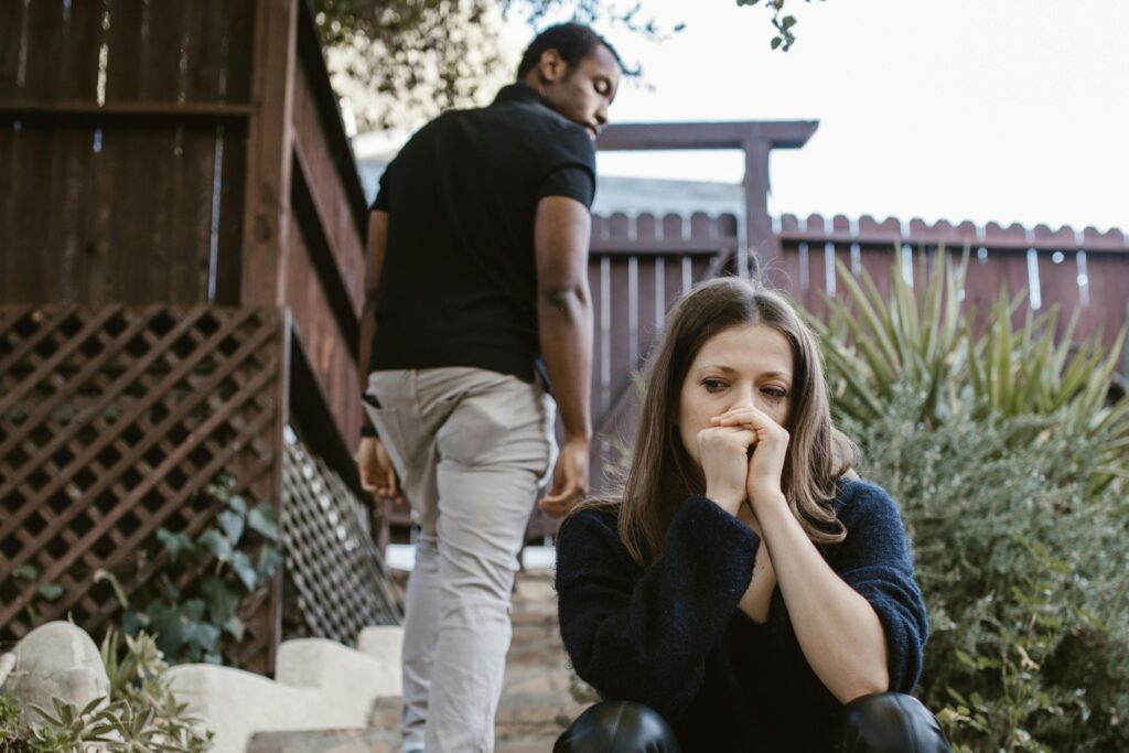 man walking away from sad woman