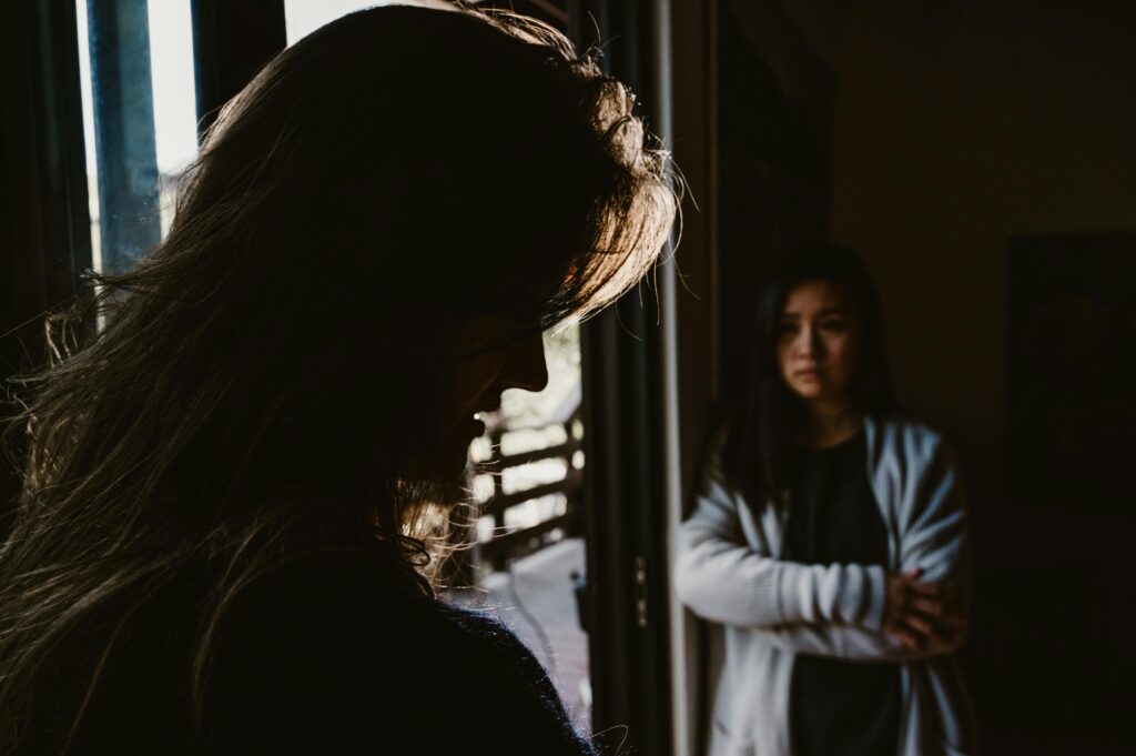 woman crossing arms looking at partner