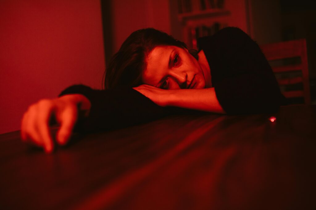 sad woman on table