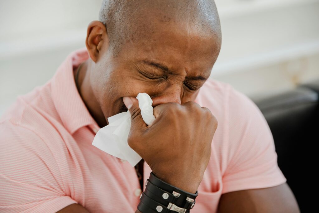 sad man holding tissue