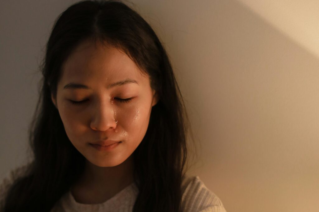 young asian woman crying