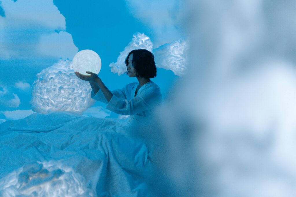 woman holding moon lamp