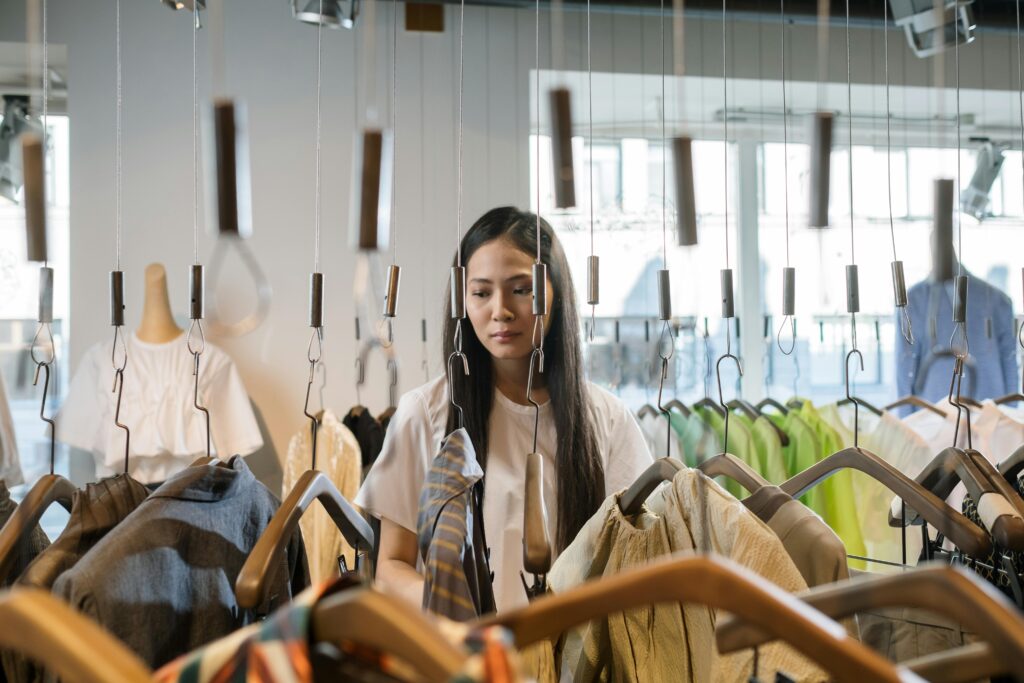 asian woman looking at clothing