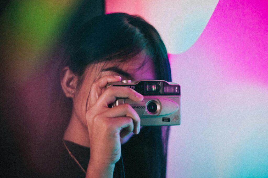 Woman Holding Camera
