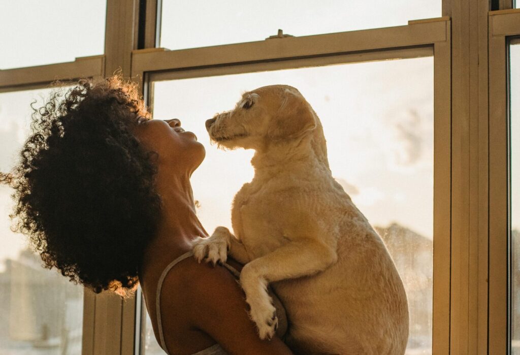 woman holding her dog