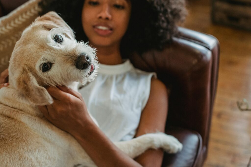 woman with dog on couch