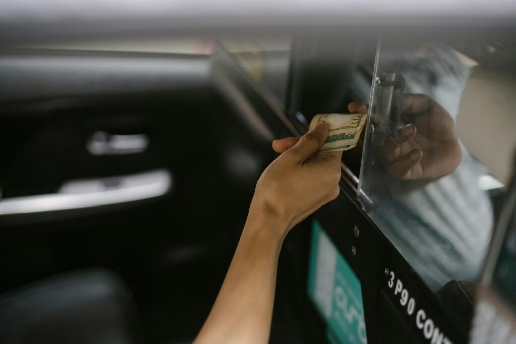 woman tipping taxi driver
