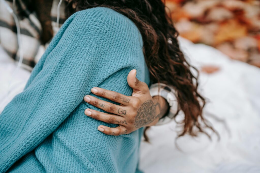 tattooted man holding woman