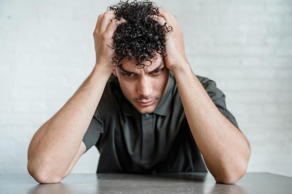 upset teenager with hands on head