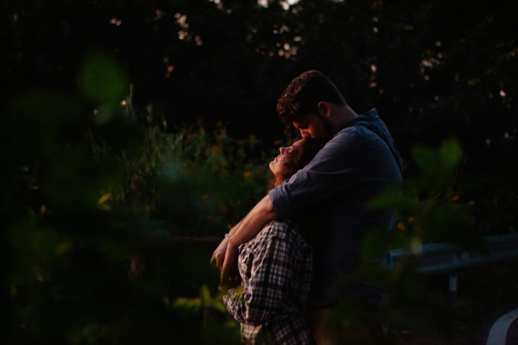 man hugging woman