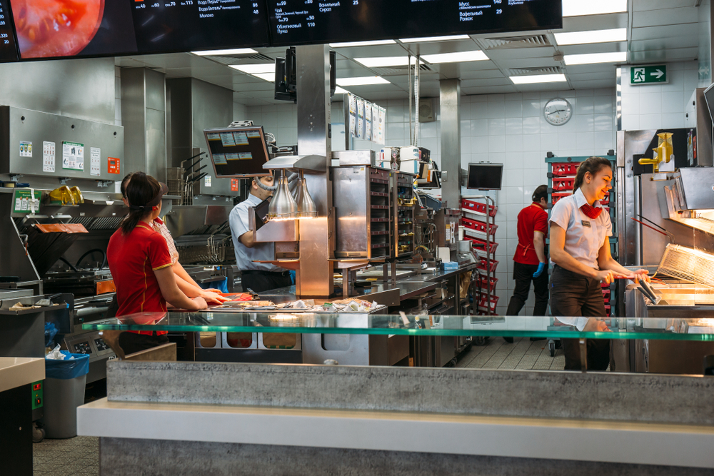 Voronezh, Russia - Circa March 2018 : Mcdonalds kitchen area with workers, famous fast food cafe or restaurant