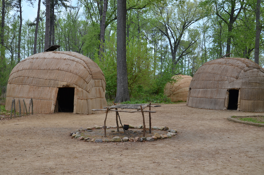 wigwam type thatch huts in native american camp site