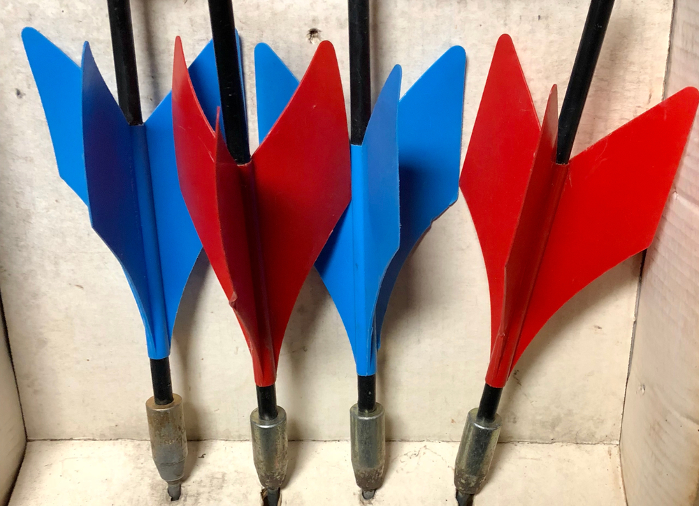 Close-up of old vintage set of red and blue lawn darts