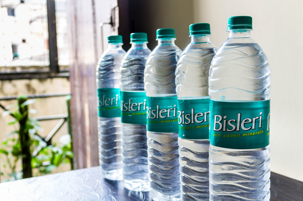 New Delhi - April 24, 2019 - Bottled mineral water of Bisleri are placed on dining table with focus on first bottle.
