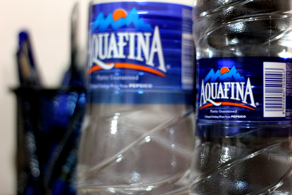 "Chandigarh , Punjab / India - April Sunday 2019: blurred view of aquafina water bottle"
