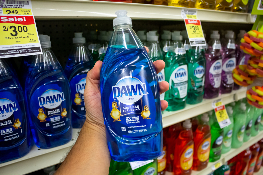 Los Angeles, California, United States - 09-22-2019: A view of a hand holding a bottle of Dawn dishwashing liquid at the grocery store.
