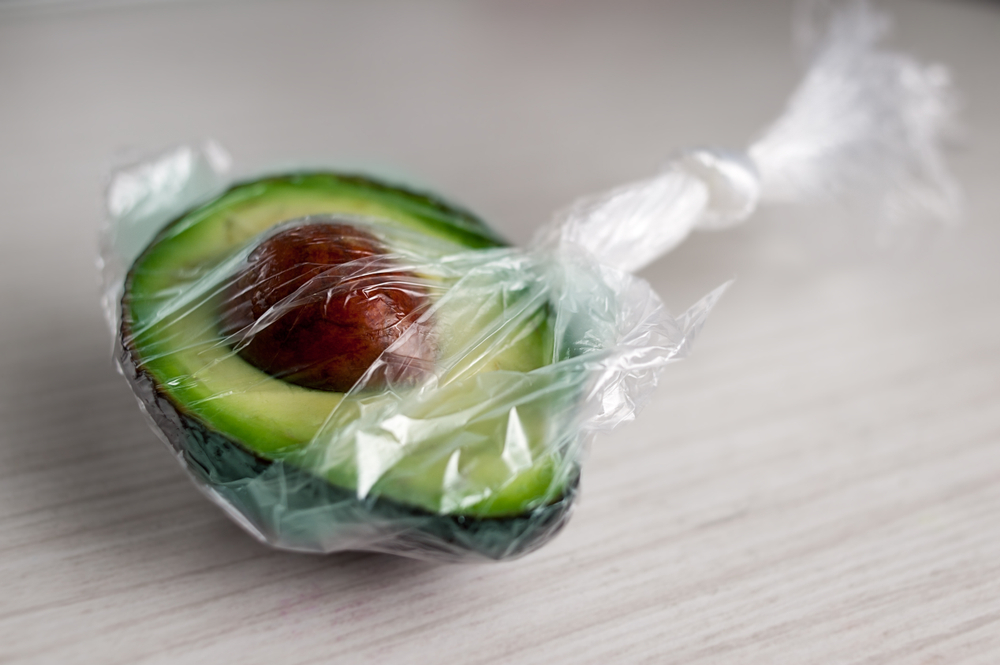 Half of avocado packed in a plastic bag