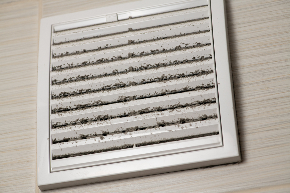 Dirty vent covered by dust causing stale air and requires cleaning. Musty smell in bathroom