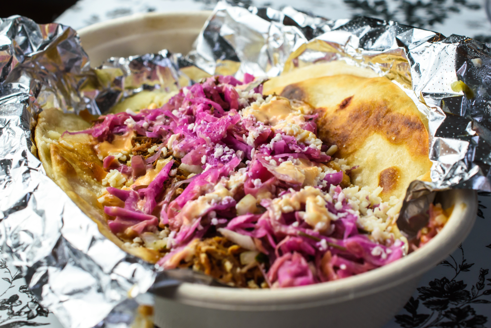 Gourmet Taco in a takeout dish with foil
