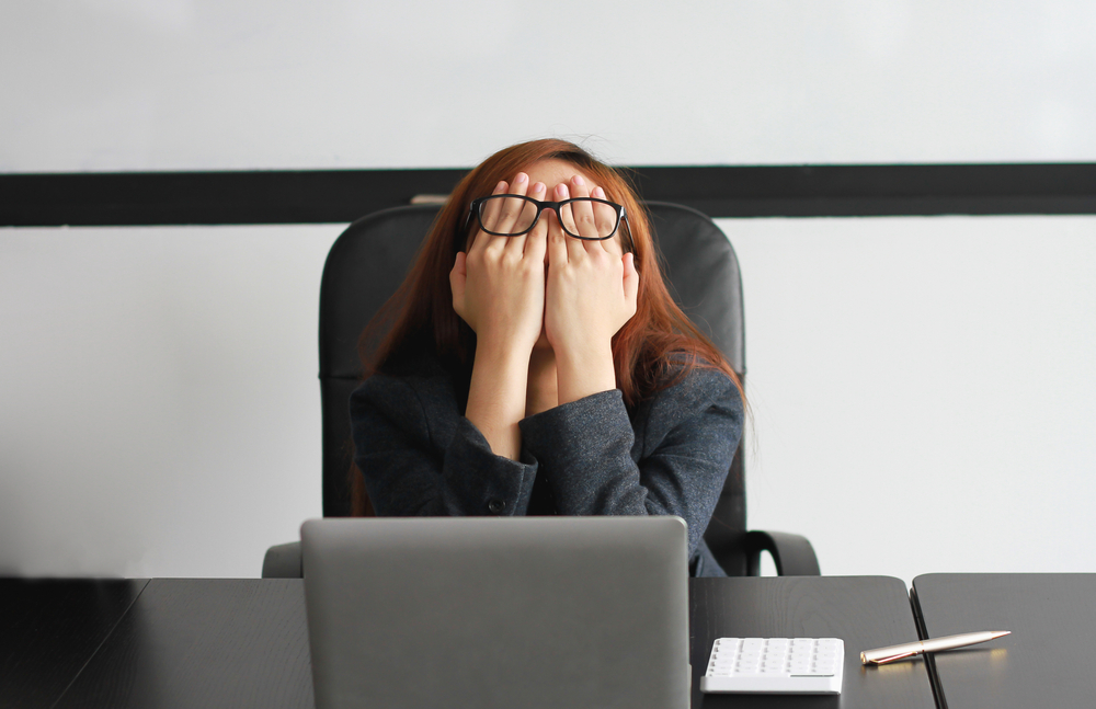 woman working in office frustrated