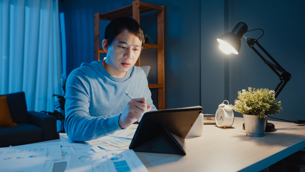 asian man working at table