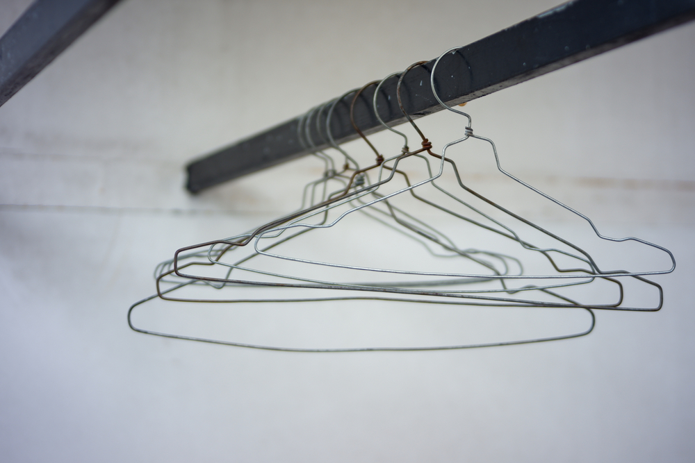 Clothes hanger made of iron hangs on the clothesline during the day