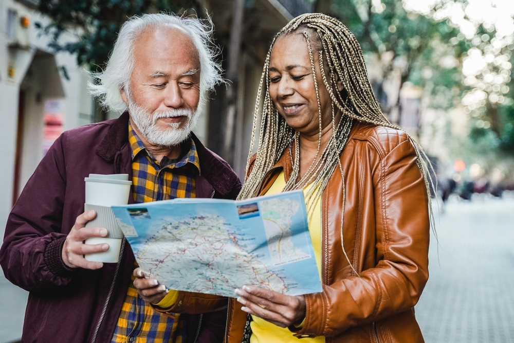 elderly couple looking at map 
