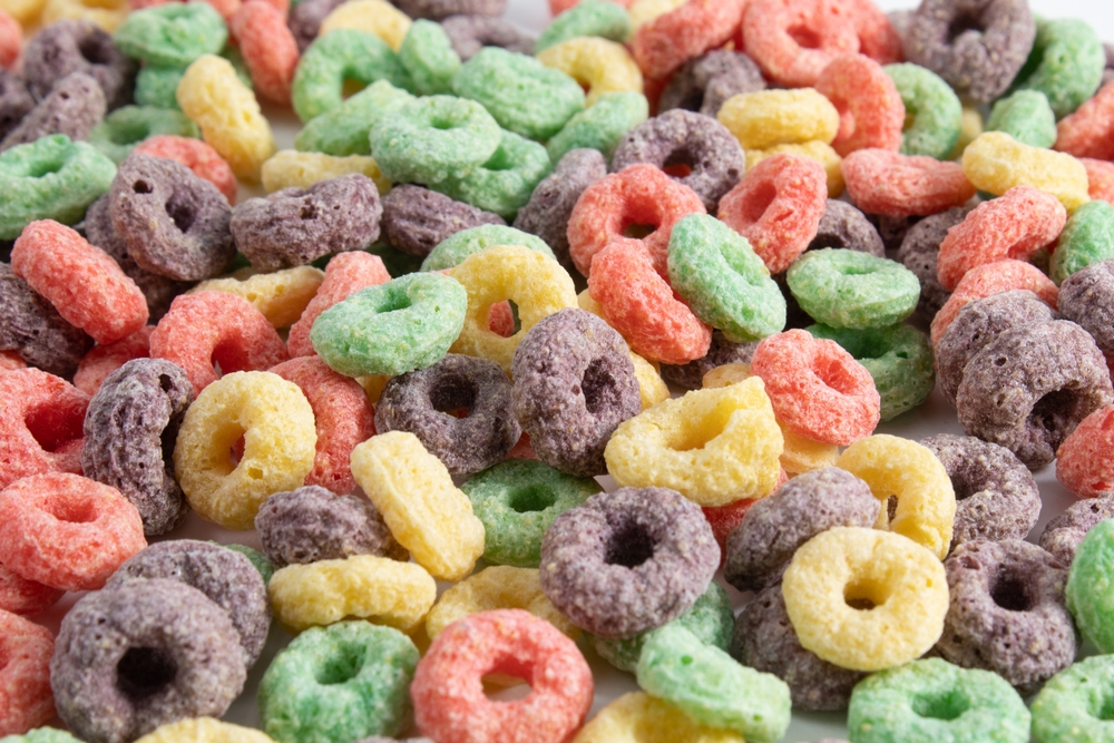Multicolored breakfast cereal texture. Healthy and tasty fruit flavored cereal
