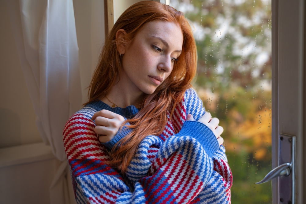Depressed woman suffering seasonal depression, feeling blue