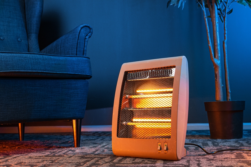 Modern electric infrared heater in the living room