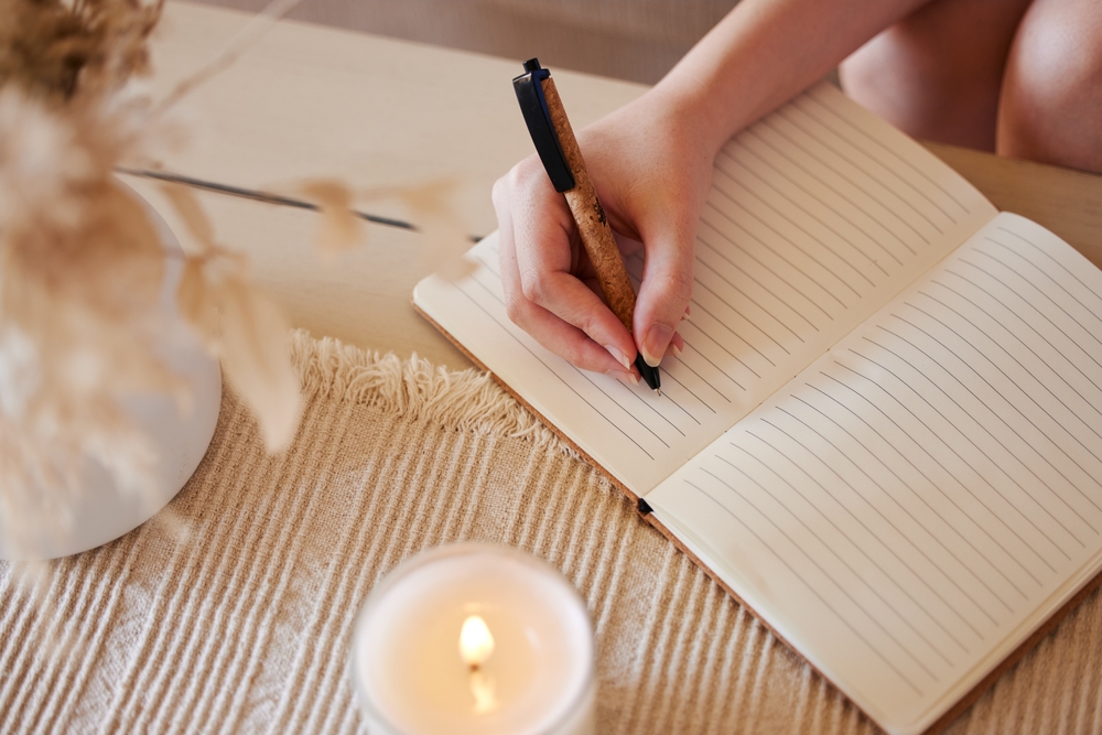 woman writing in notebook