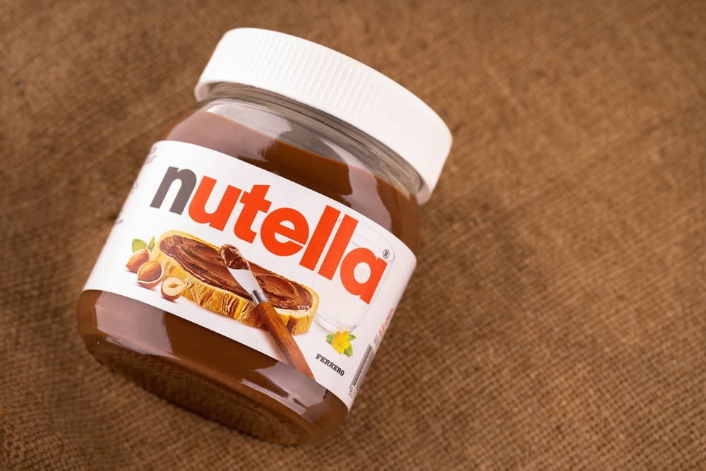 Ukraine, Dnipro, 03.05.20223: Jar of Italian Nutella hazelnuts cream made by Ferrero. Chocolate hazelnut spread. Dessert	