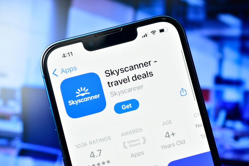 New Delhi, India 28 April 2024 :- Skyscanner app on smartphone use to book cheap flight and hotel online