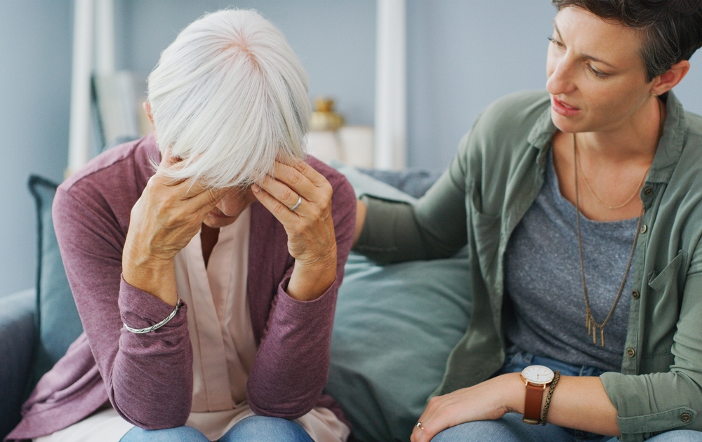 Senior mom, stress and daughter with support for mental health crisis, compassion and dementia in home. Elderly mother, sad and woman with empathy for retirement debt, kindness and financial mistake