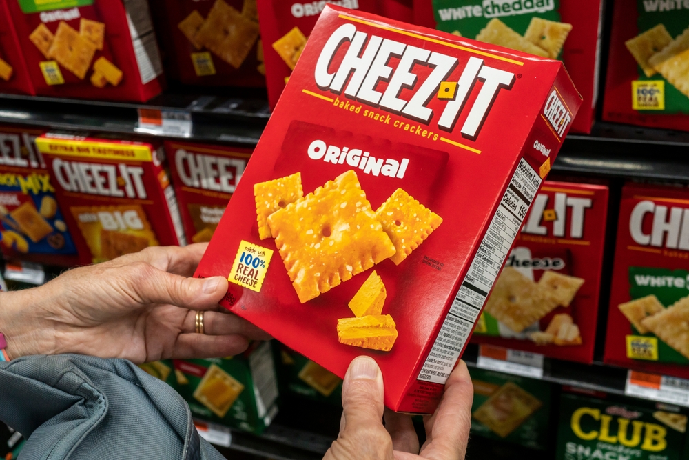 hands holding box of Cheez-it 