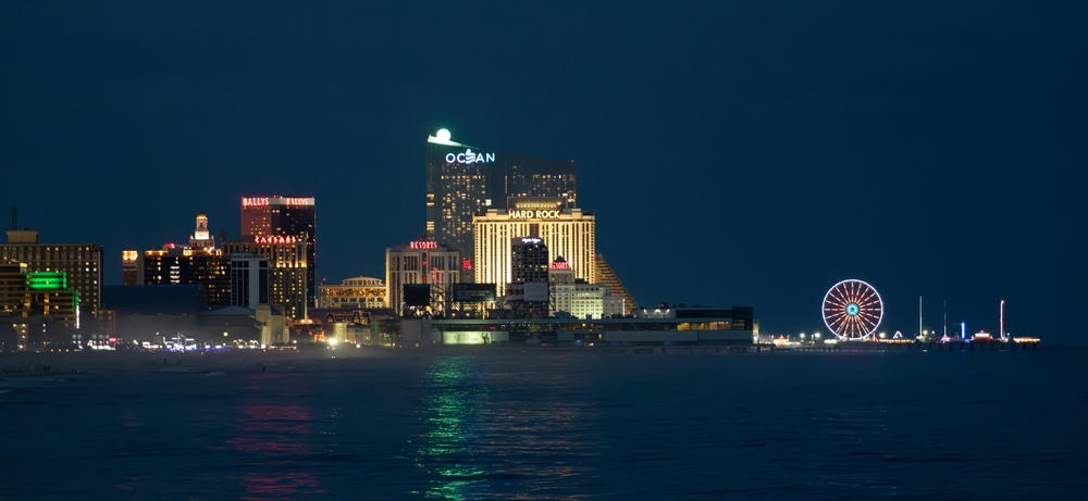 Atlantic City, New Jersey-USA-08-1-2023: Night photo of Atlantic City skyline featuring Ocean Casino and Resort, Hard Rock Casino, Bally Casino and Hotel as well as the Steel Pier amusement park.
