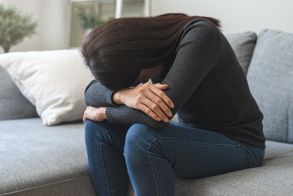 Sad, unhappy. Alone asian young woman, girl expression face thinking about problem, difficulty, feeling failure and exhausted, suffering from loneliness, grief sorrow and bad relationship or break up.