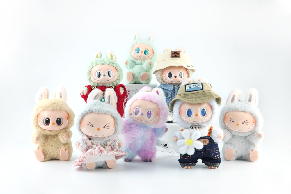 Bangkok Thailand 9 May 2025, art toys Labubu key chain collection from Pop Mart blind box collectable cute toys display white shelf background at Pop mart store new release big into energy labubu doll