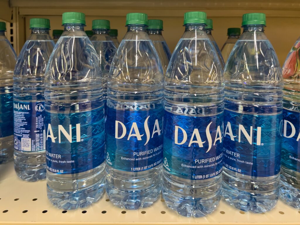 Oklahoma, USA - March 21, 2022: Dasani Purified Water 1 Liter bottles on the shelf in a supermarket. Oklahoma, USA
