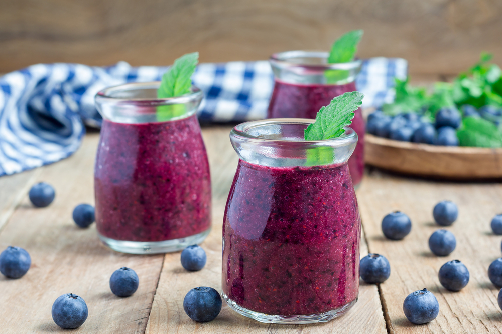 Fresh smoothie with blueberry, plum, mint and basil, horizontal