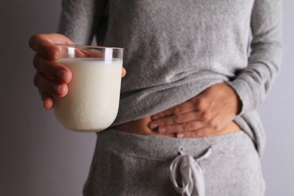 woman holding glass of milk