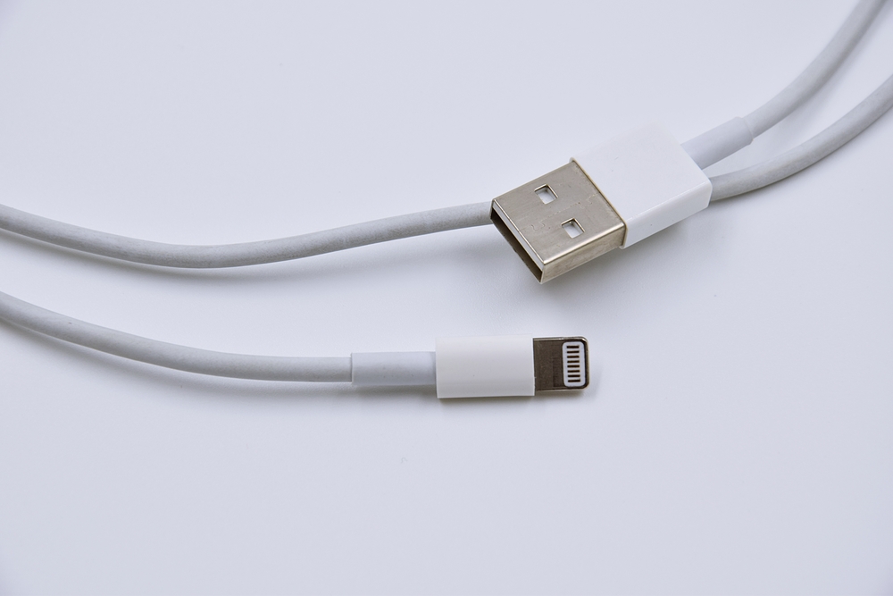 usb chargers smart phone cable and plug on white background
