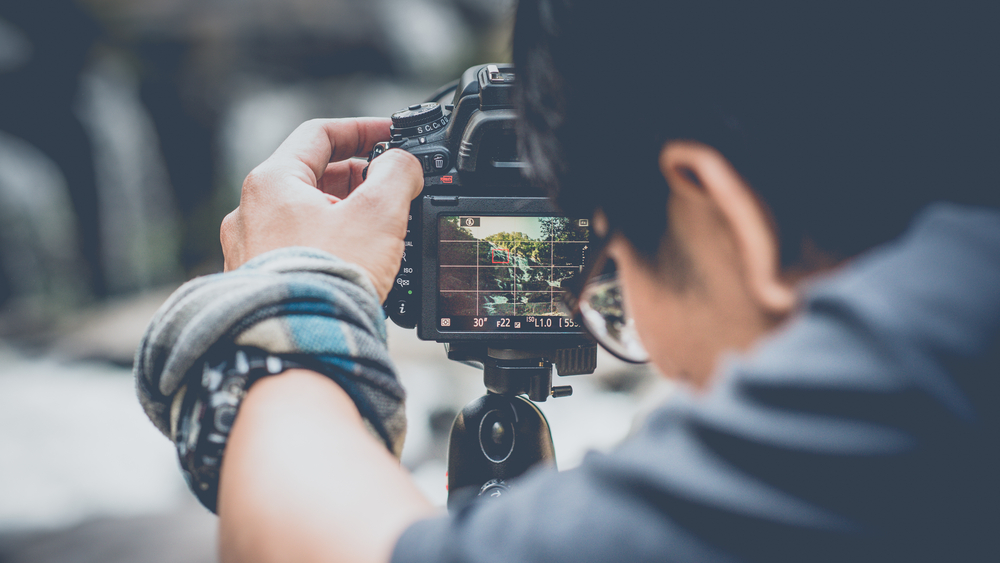 man taking a photograph