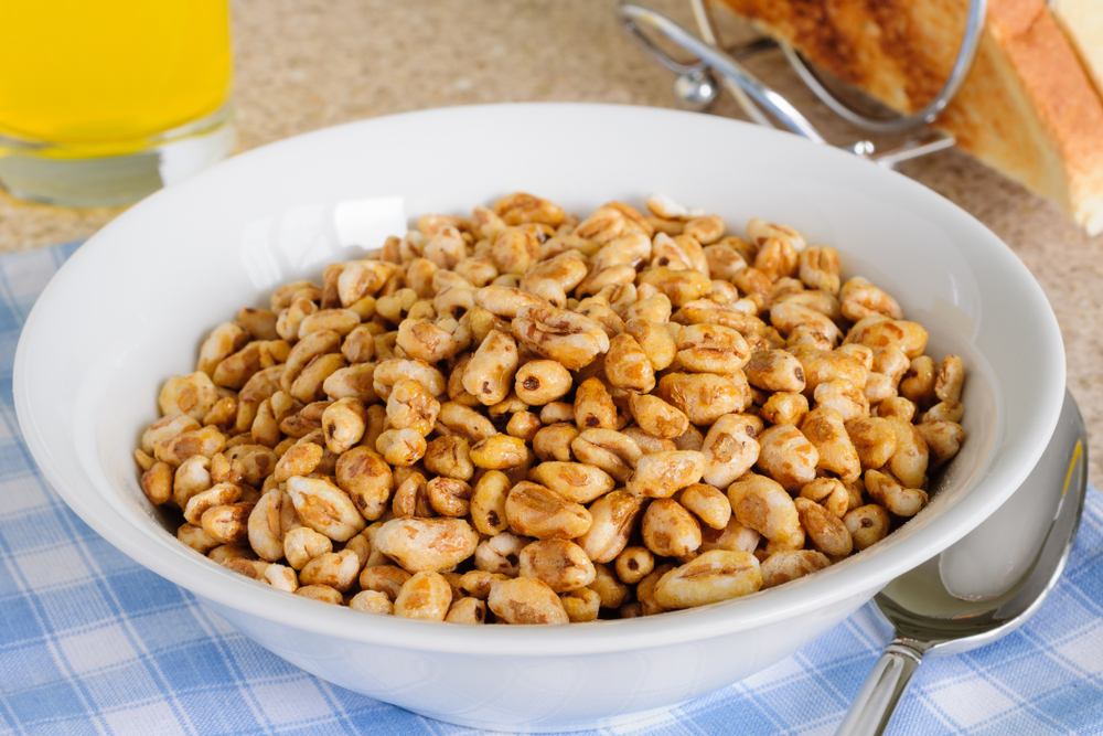 Honey coated puffed wheat breakfast cereal